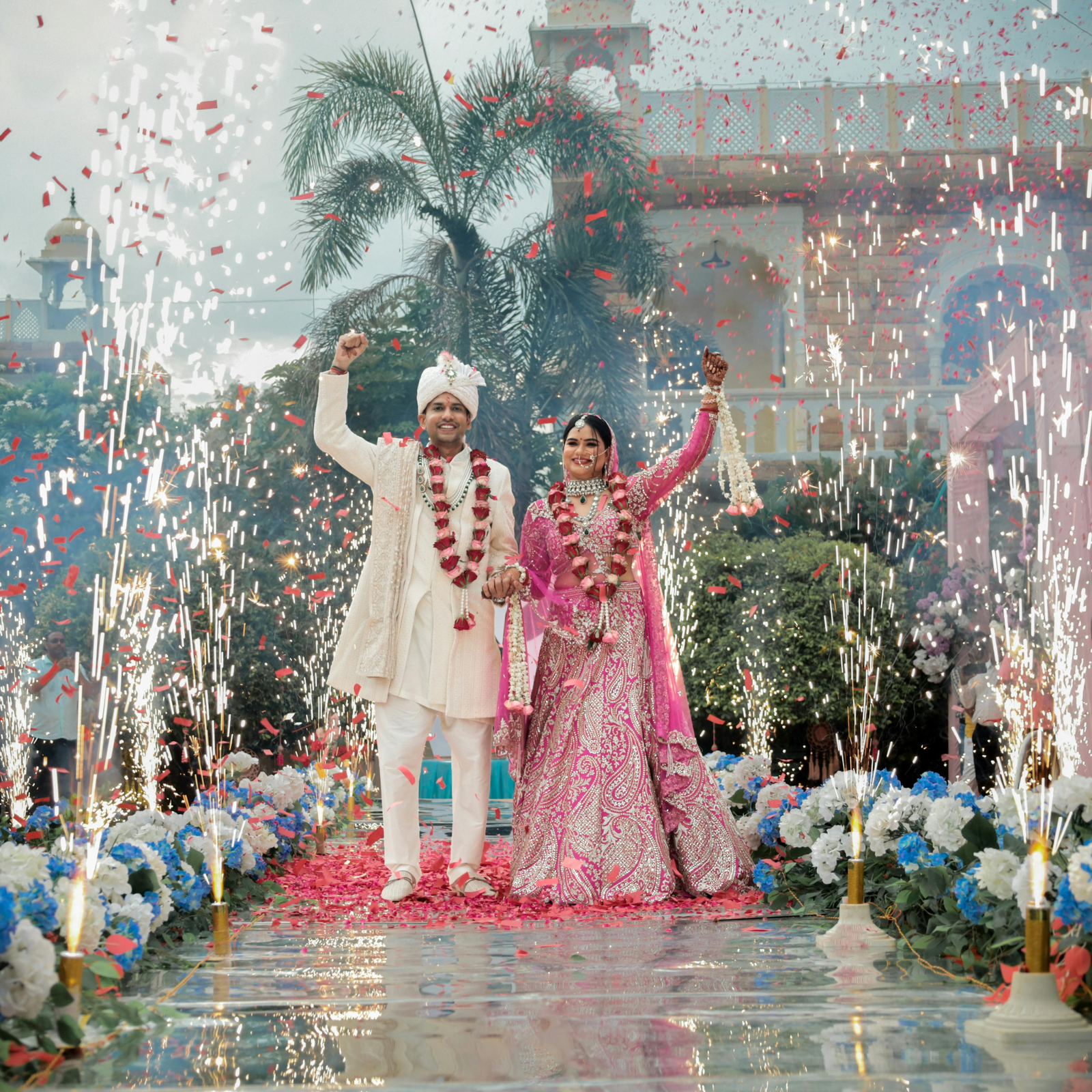 Bride and groom celebrating amid sparkling stage effects