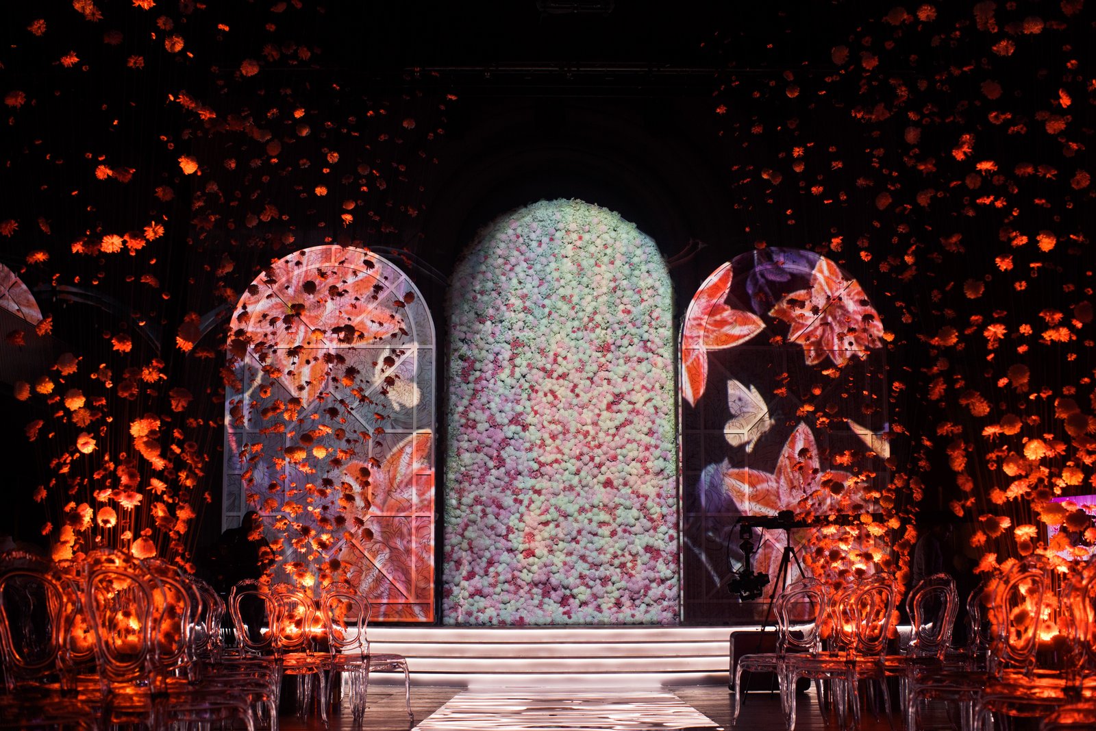 Dramatically lit floral wedding stage